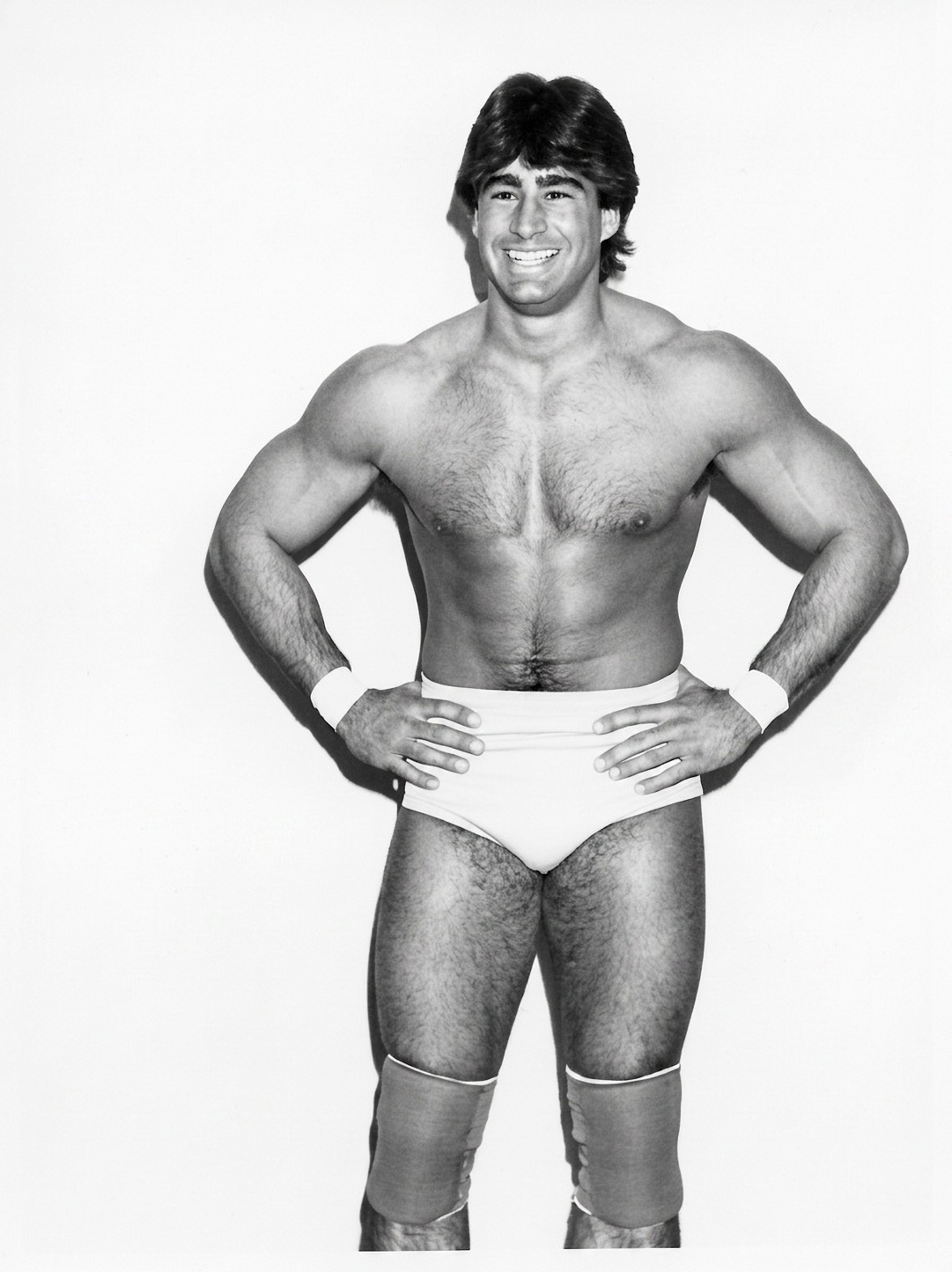 Tom Zenk wearing a jacket in an official promotional portrait