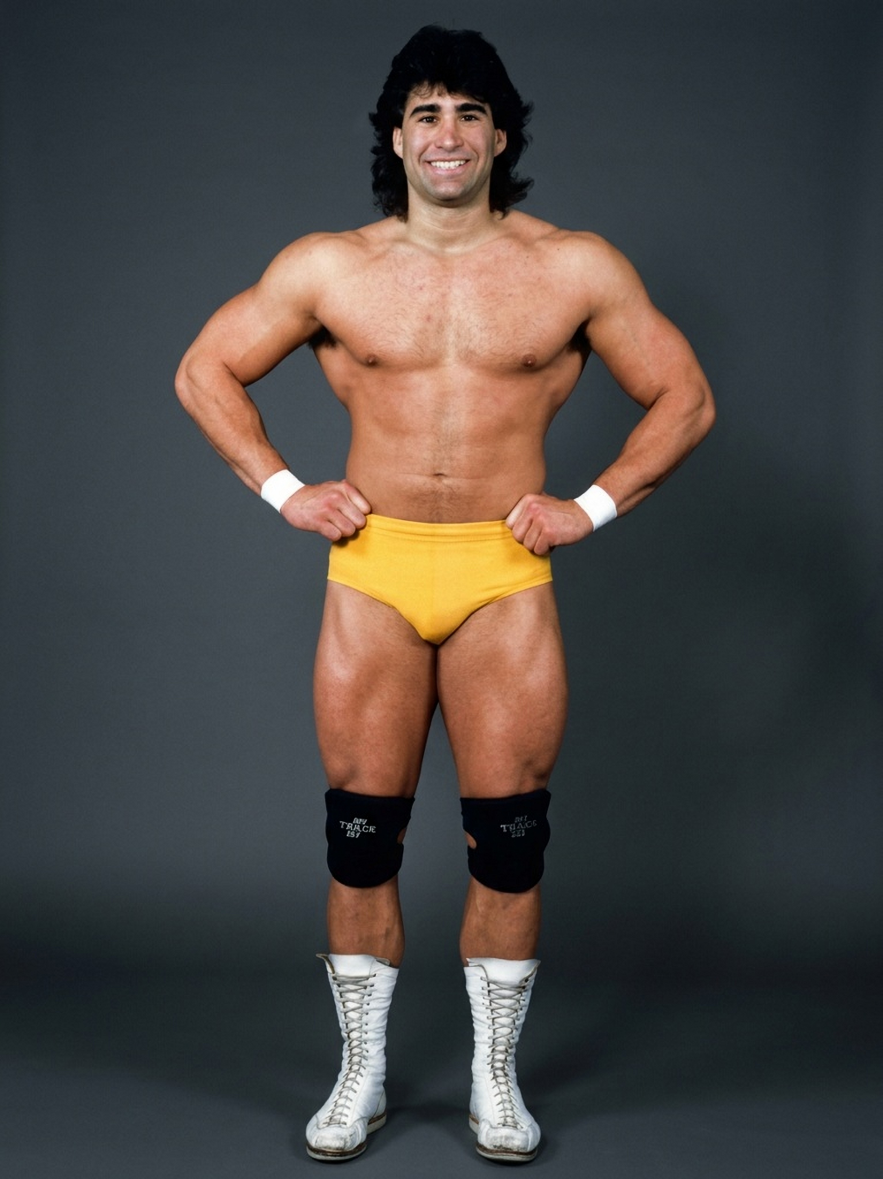 Young Tom Zenk in yellow trunks